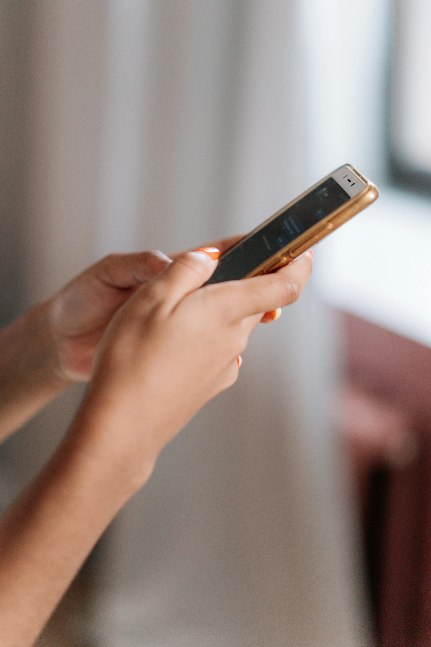 A person reaching out on their phone